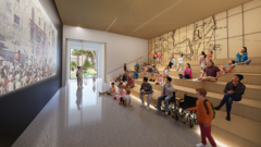 Indoor theater with children sitting on steps for seating