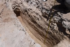 Dug out trench facing northeast in a dirt area