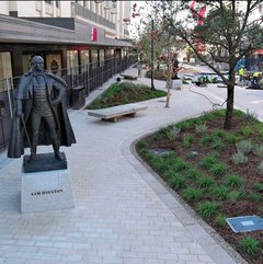 Paved walkway with a Sam Houston statue on the path