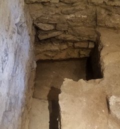 Dark and light soil inside of an excavation unit