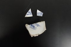 Three ceramic fragments, white with blue design