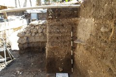 Excavation unit showing tower of fill and shorter rocky surface