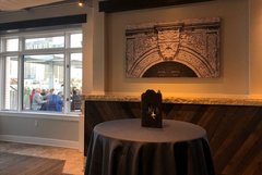 Table display in from of wall art and a window