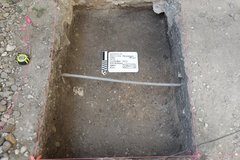 Tube across middle of excavation unit
