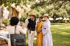 Visitors take a photo with living historians.
