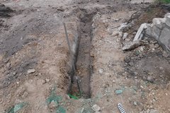 Utility trench next to a tree planter