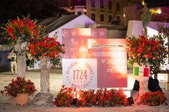 Columns and red floral arrangements in Alamo Plaza