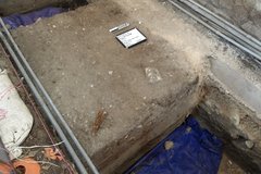 Inside of an excavation unit with blue tarp at the bottom