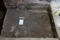 Inside an excavation unit about 50 cm below the surface