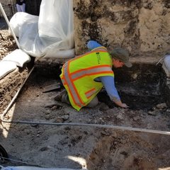Archaeologist inside an excavation unit