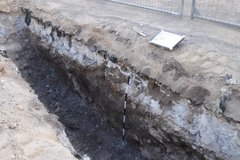 Backhoe trench facing northeast