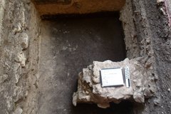 Dark dirt at the bottom of an excavation unit