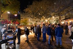 Guests in Alamo Hall Patio exploring food stations