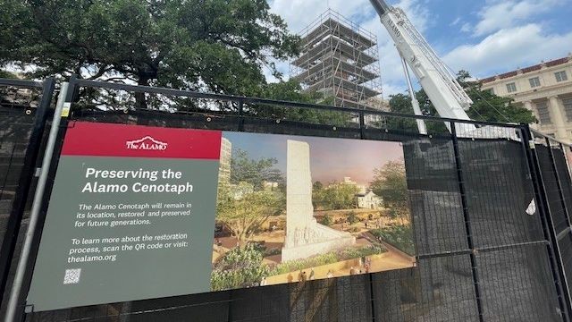 Fence and scaffolding around cenotaph with rendering of future image once work is complete