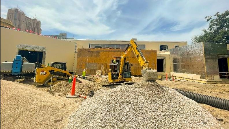 Construction truck outside of education center building