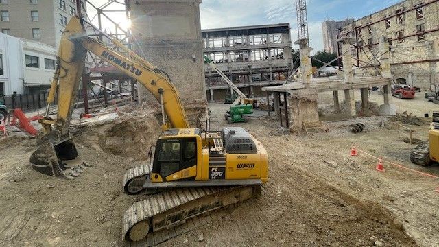 Construction truck and crane in project area for future museum