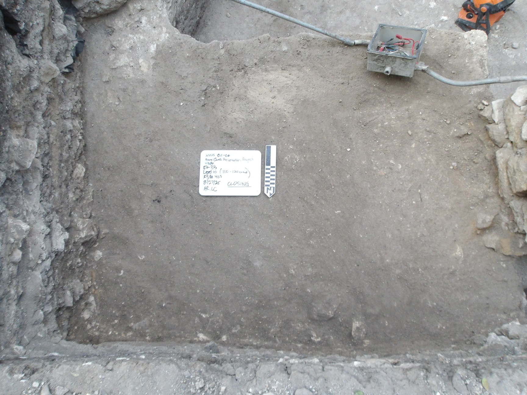 Flat surface with limestone border inside an excavation unit