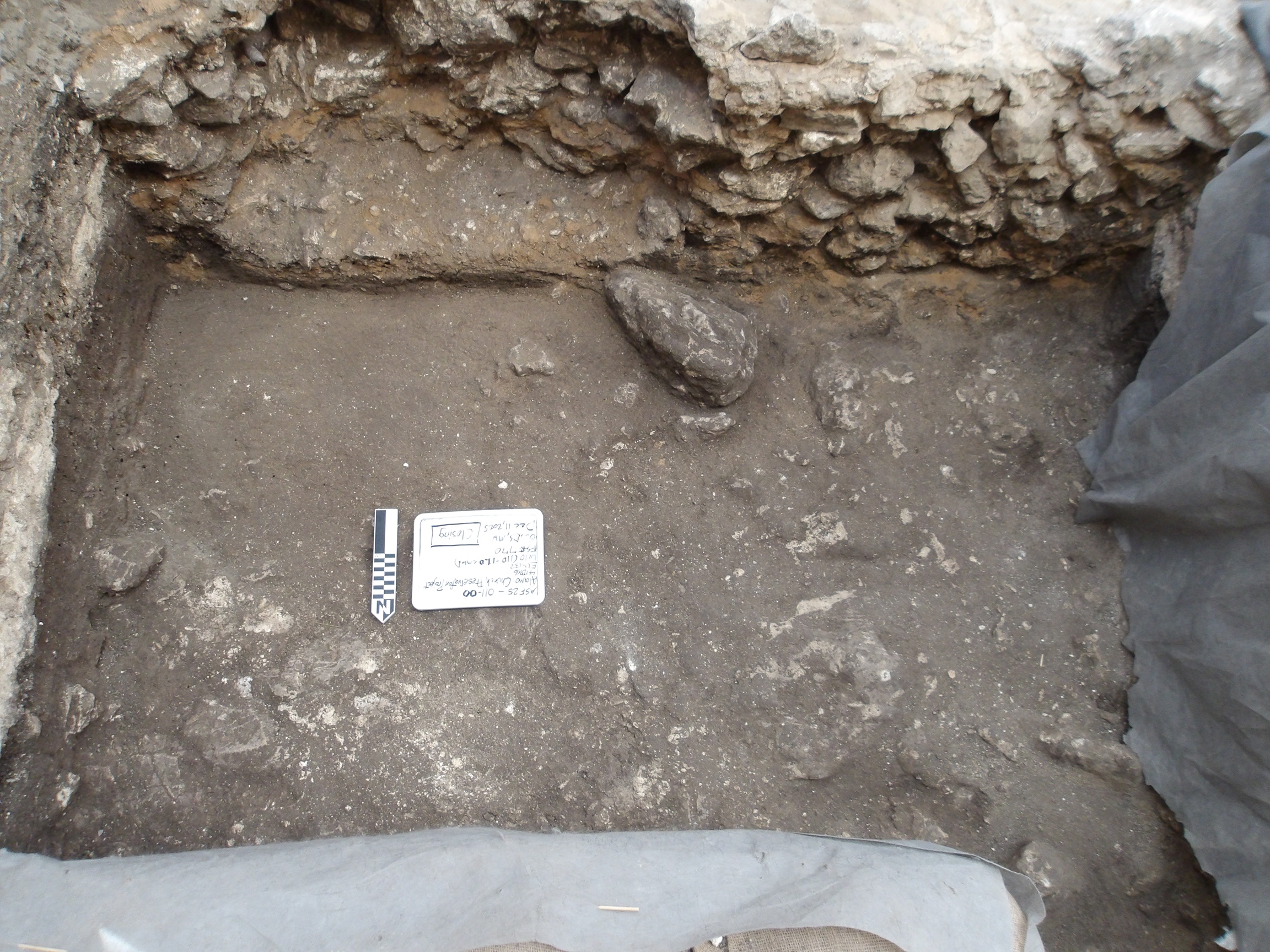 Natural caliche hardpan at bottom of excavation unit