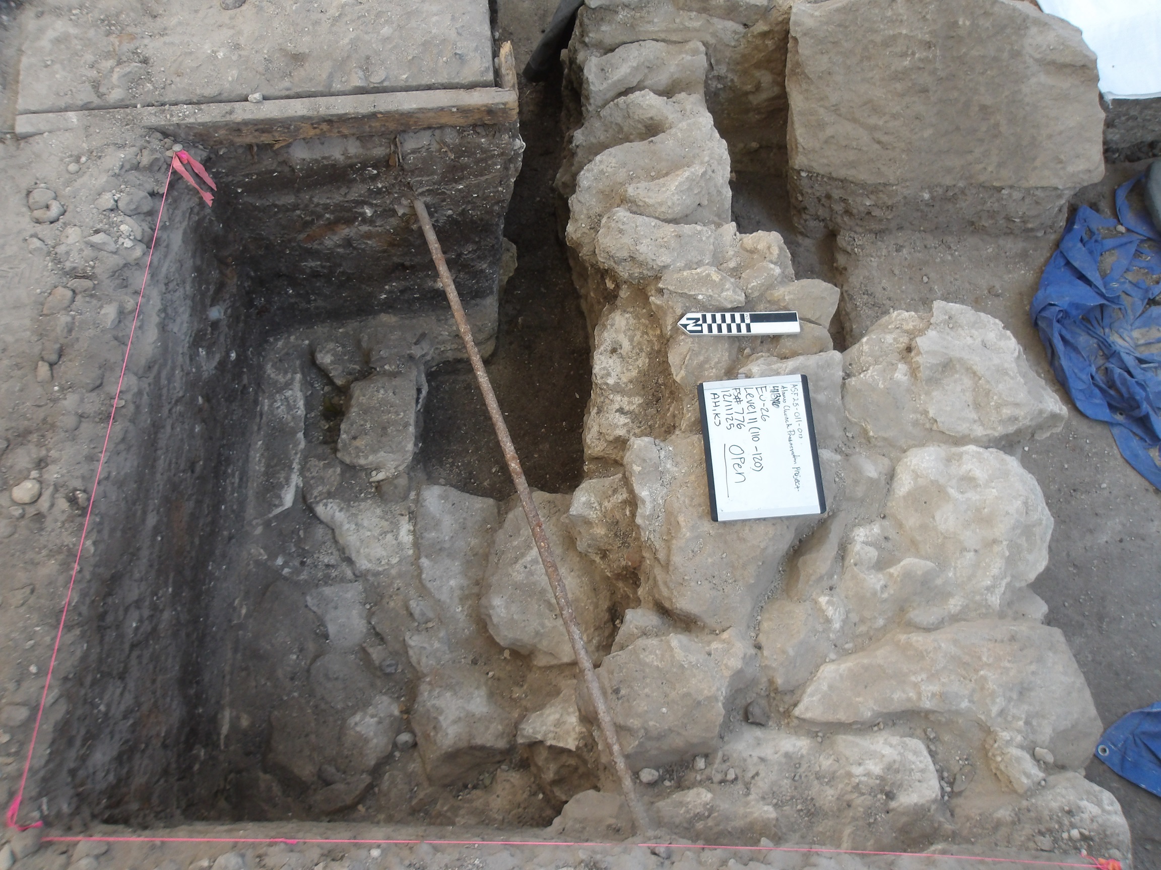 Limestone feature with varying alignments inside an excavation unit