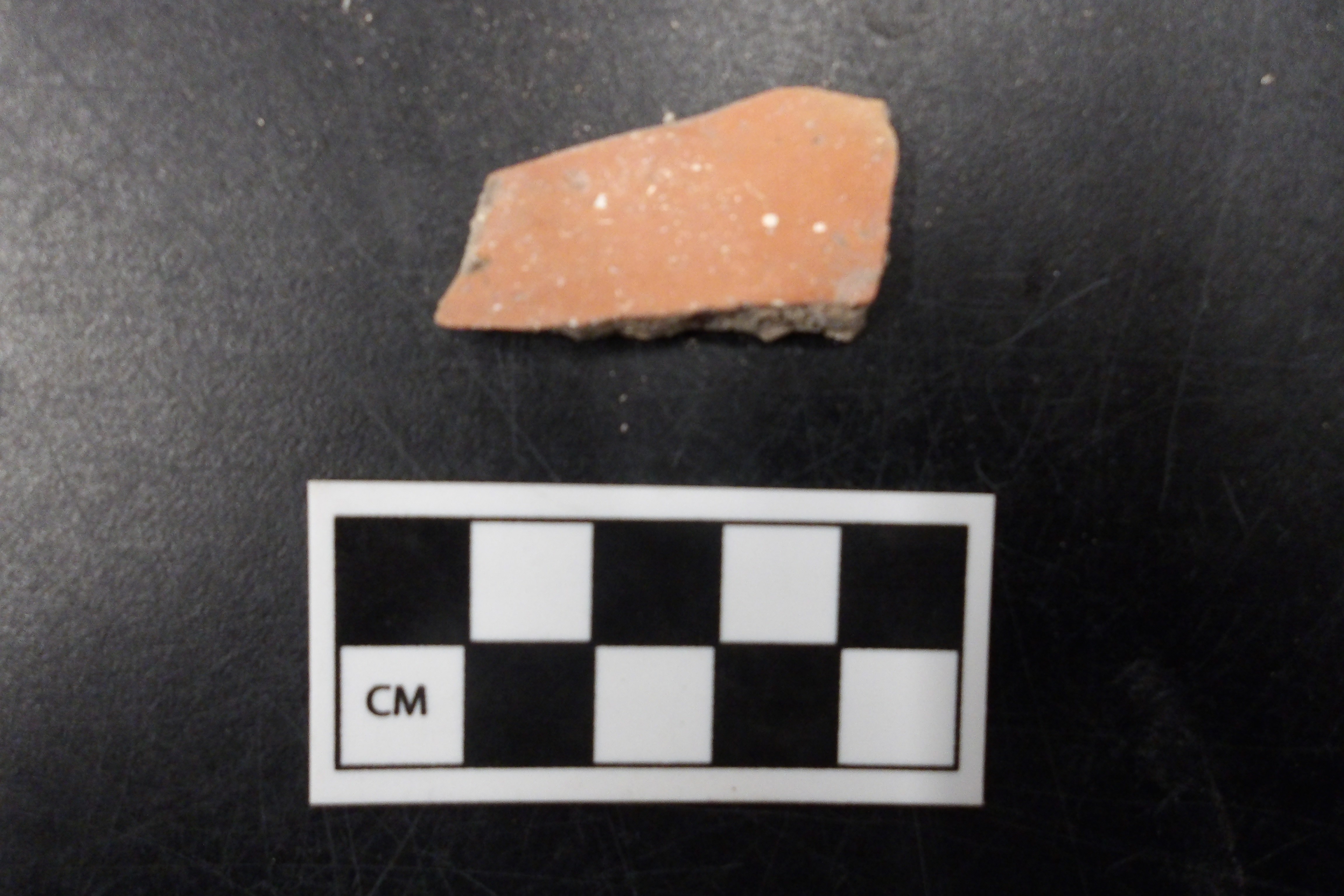 Goliad sherd next to a ruler for size