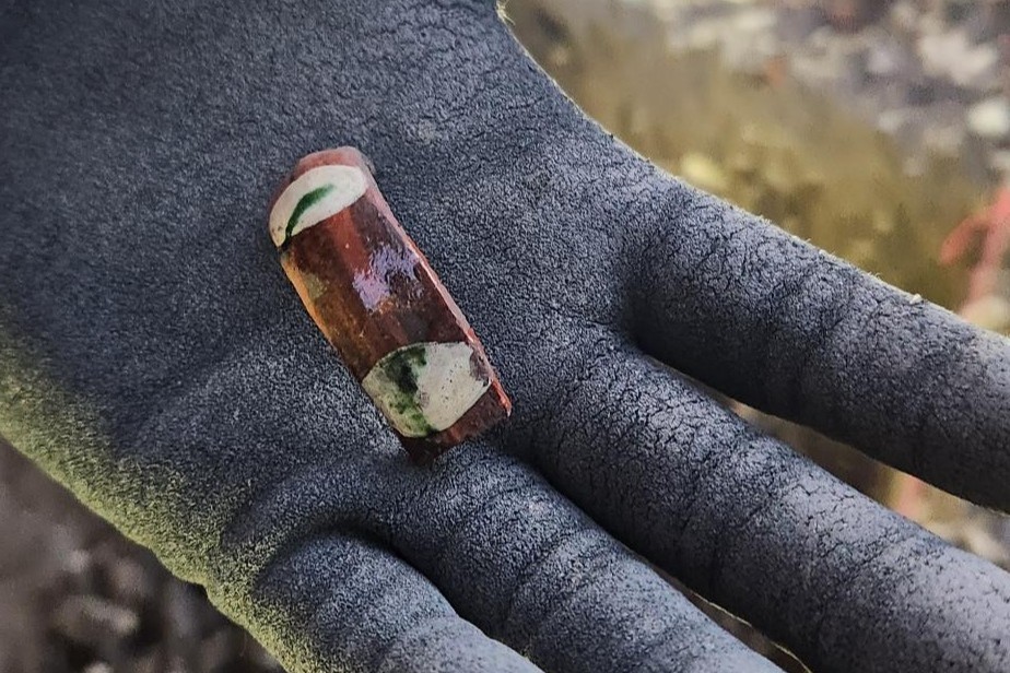 Galera handle inside a gloved palm of hand