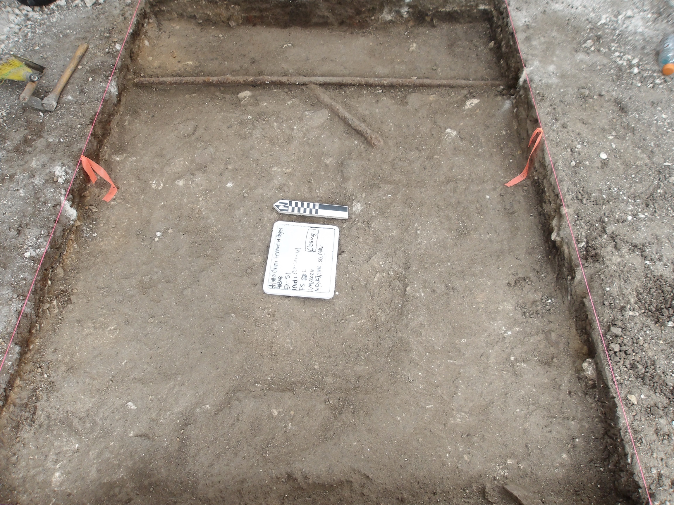 Two utility pipes inside an excavation unit