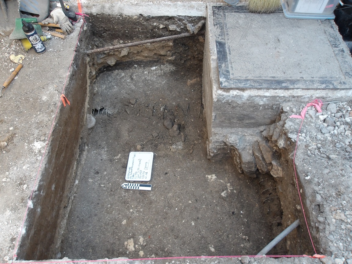 Inside of an excavation unit 70 cm below surface with two utility pipes