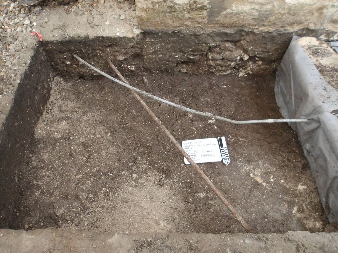 Two utility pipe 50 cm below surface in an excavation unit