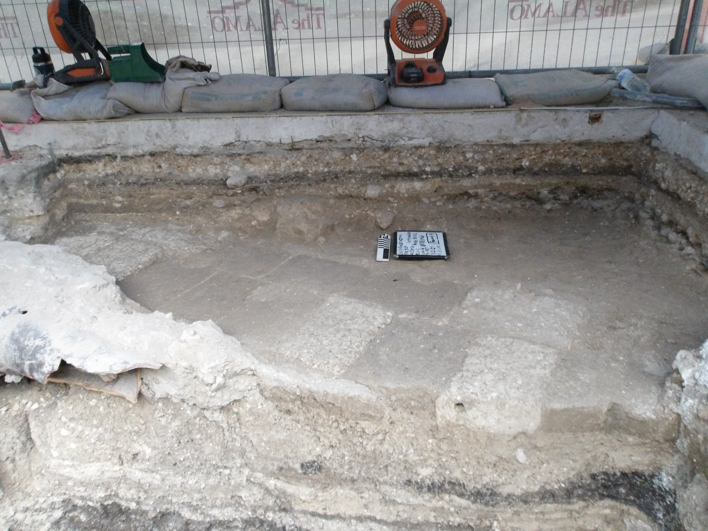 Adobe pavers exposed below surface of excavation unit