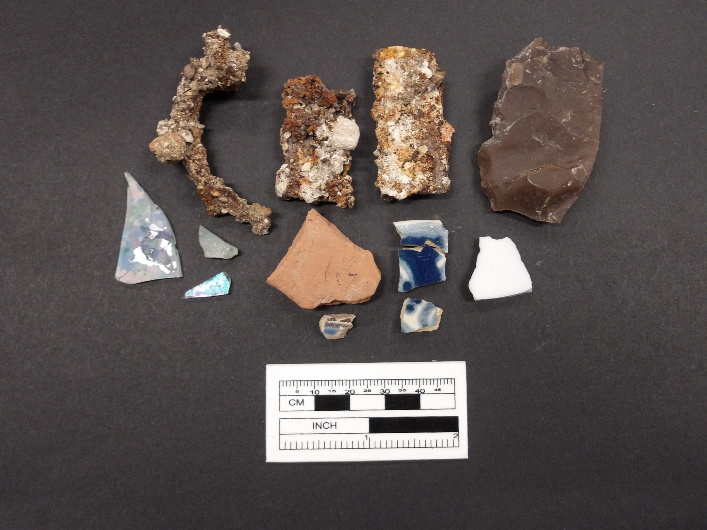 Spanish Colonial ceramics, glass shards, lithics, and metal fragment artifacts from excavation unit