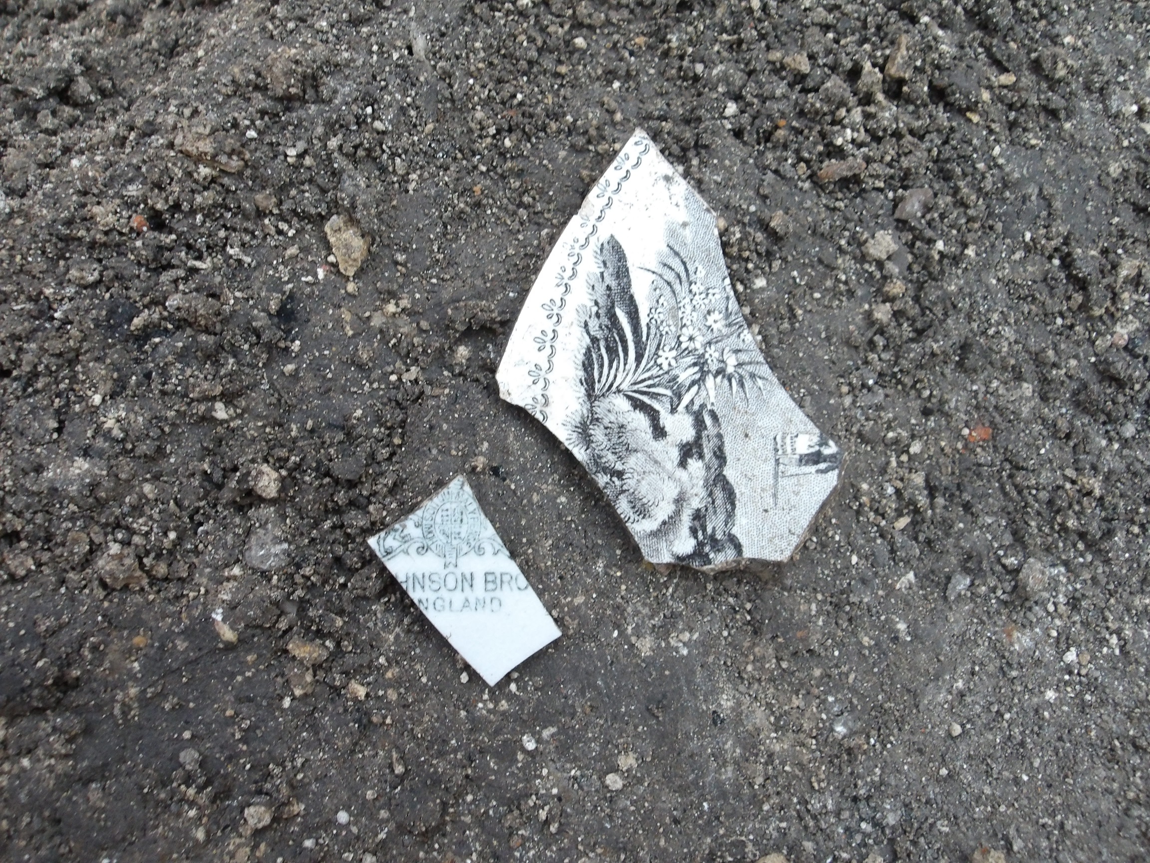 Fragments of ceramic with a black ink artistry