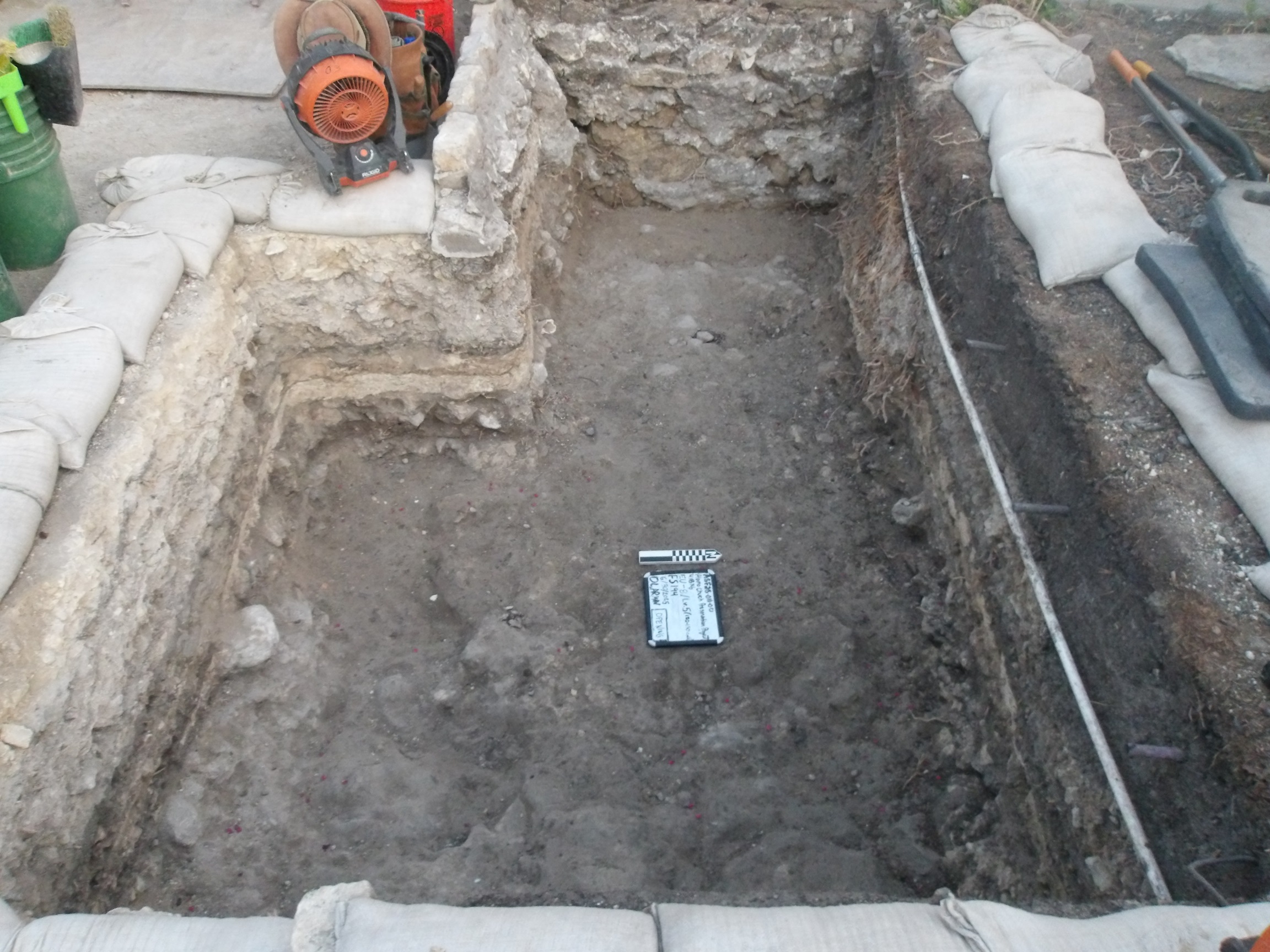 Inside of an excavation unit with a stair step side border