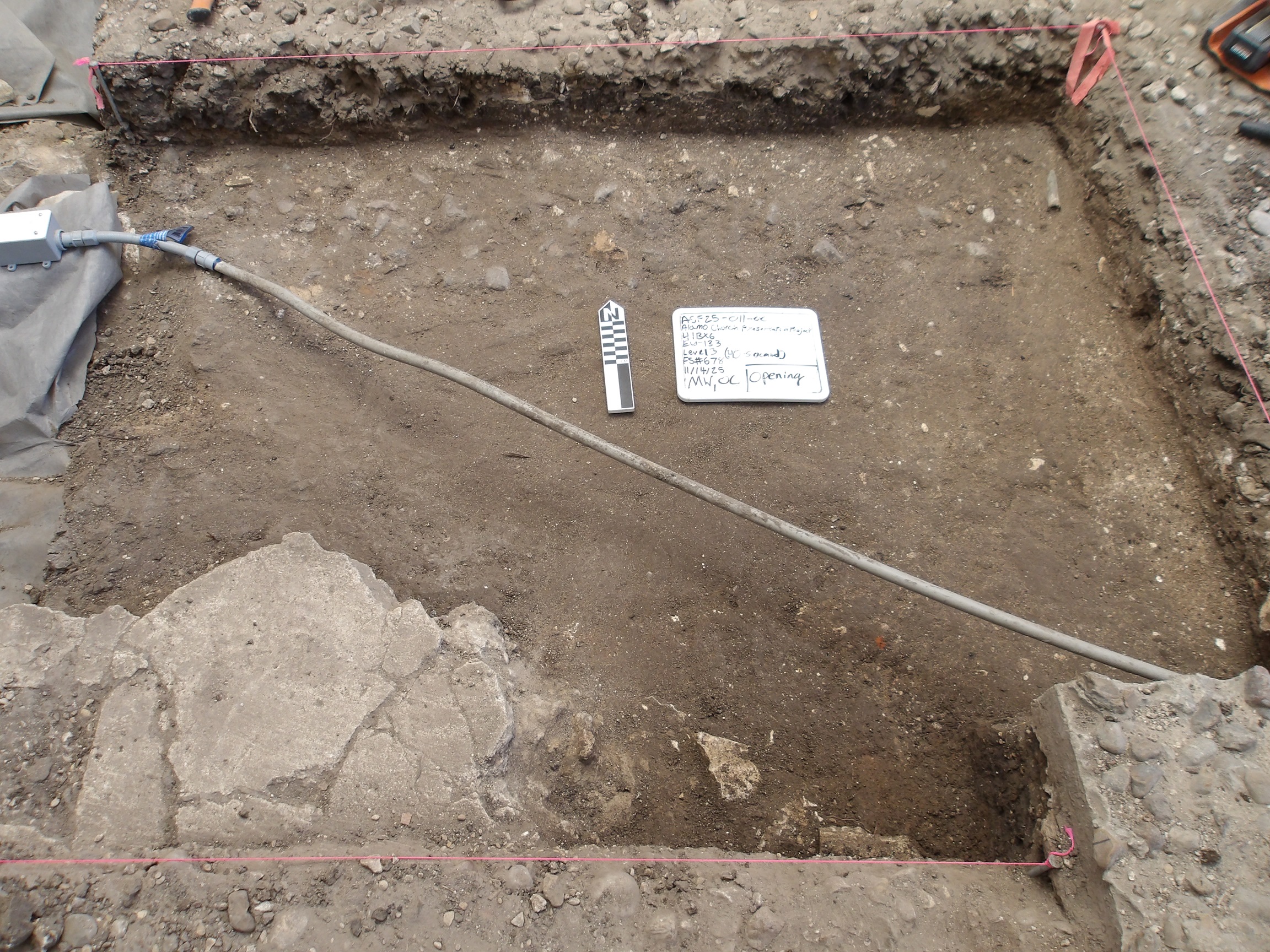 Diagonal wire across the inside of an excavation unit