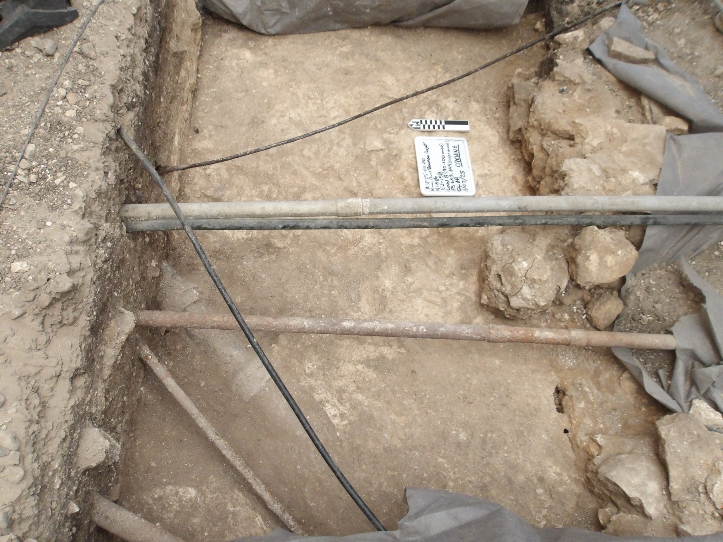 Two pipes connecting sides of excavation unit
