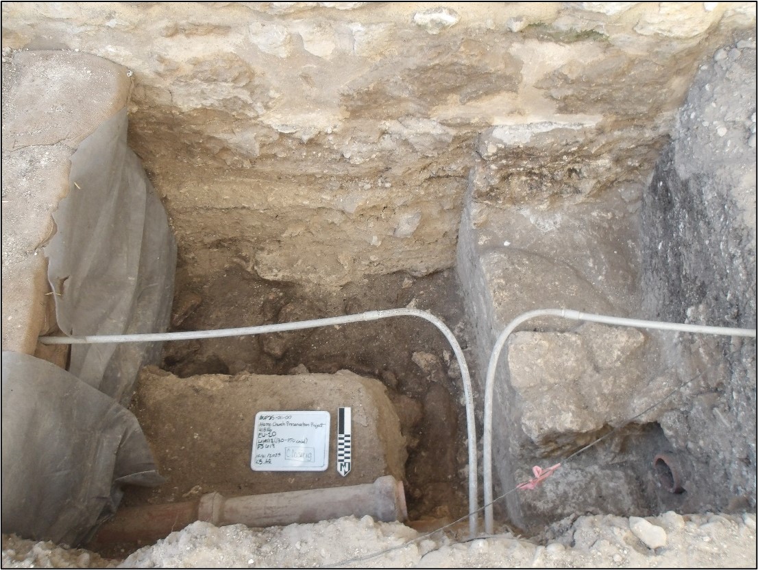 Builders trench and clay pipe inside an excavation unit